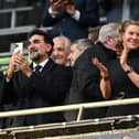 Newcastle United’s Saudi Arabian chairman Yasir Al-Rumayyan (L) and Newcastle United’s English minority owner Amanda Staveley (C) applaud the players ahead of the English League Cup final football match between Manchester United and Newcastle United at Wembley Stadium, north-west London on February 26, 2023. 
