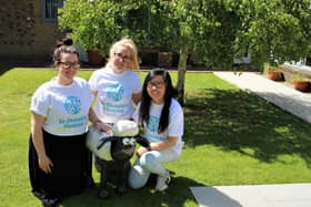 Members of the St Oswald's Hospice team with the small Shaun sculpture.