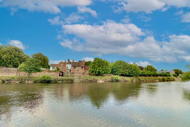 A man was arrested on suspicion of murder after a woman’s body was found in the river in Wales.