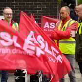 LONDON, ENGLAND - MAY 31: A group of rail workers stand on a picket line outside Euston rail station as a new round of strikes by train drivers begins on May 31, 2023 in London, England. Today's strike comes after the train drivers union, ASLEF, rejected a pay rise offer of 4 percent a year over two years from the Rail Delivery Group (RDG). (Photo by Leon Neal/Getty Images)