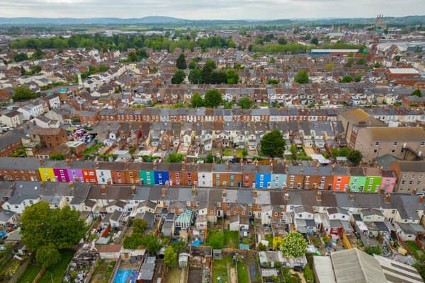 Tasha Frootko and partner Stuart Doust have transformed a street by painting the houses bright colours in Gloucester.