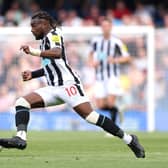 Allan Saint-Maximin of Newcastle United controls the ball during the Premier League match between Chelsea FC and Newcastle United at Stamford Bridge on May 28, 2023 in London, England.