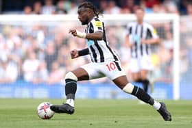 Allan Saint-Maximin of Newcastle United controls the ball during the Premier League match between Chelsea FC and Newcastle United at Stamford Bridge on May 28, 2023 in London, England.