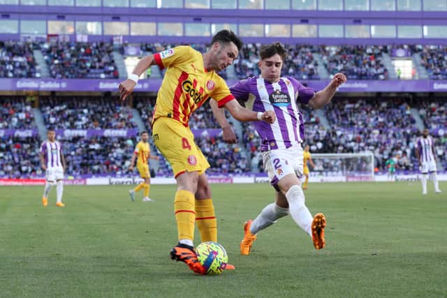 Arnau Martinez of Girona FC is put under pressure by Ivan Fresneda of Real Valladolid CF during the LaLiga Santander match between Real Valladolid CF and Girona FC at Estadio Municipal Jose Zorrilla on April 22, 2023 in Valladolid, Spain.