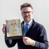 Charles Hanson, owner of Hansons Auctioneers, with a childhood drawing of Queen Elizabeth II drawn by a very young King Charles.  