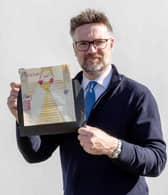 Charles Hanson, owner of Hansons Auctioneers, with a childhood drawing of Queen Elizabeth II drawn by a very young King Charles.  