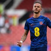 James Maddison warms up for England