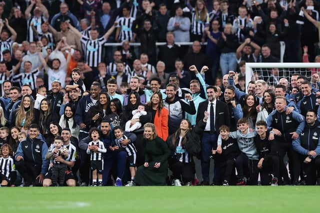 Players, staff and families of Newcastle United pose for a photo after their team qualifies for the UEFA Champions League following the Premier League match between Newcastle United and Leicester City at St. James Park on May 22, 2023 in Newcastle upon Tyne, England. (Photo by Alex Livesey/Getty Images)