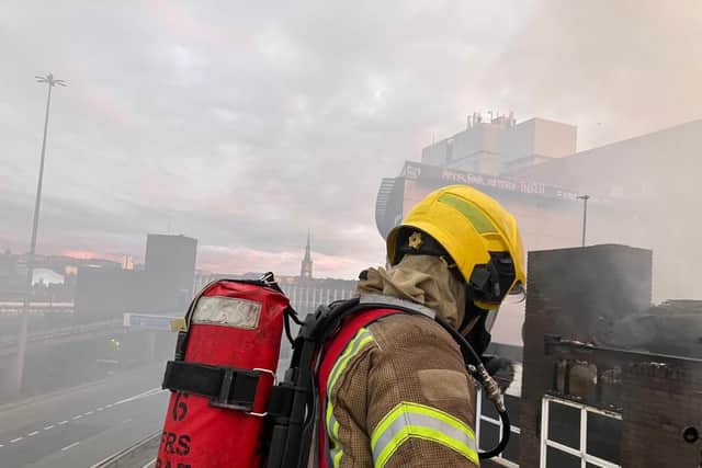Fire crews used an aerial platform as part of their efforts to extinguish the blaze. Photo: TWFRS.