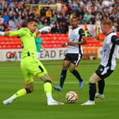Newcastle United goalkeeper Karl Darlow and Gateshead forward Adam Campbell. (Photo credit: Jack McGraghan - Gateshead FC)