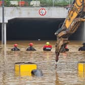 Rescue workers are searching for missing people after a tunnel flooded in South Korea