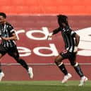 Newcastle United midfielder Joe Willock (left) and Allan Saint-Maximin. (Photo by Clive Brunskill/Getty Images)