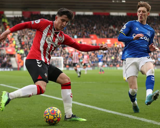 Tino Livramento of Southampton crosses the ball during the Premier League match between Southampton and Everton at St Mary’s Stadium on February 19, 2022 in Southampton, England. 