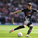 Tino Livramento of Southampton shoots during the Premier League match between Brighton & Hove Albion and Southampton at American Express Community Stadium on April 24, 2022 in Brighton, England.