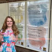 Gosforth poet Anna Woodford with the latest poetry displays at Longbenton Metro station.