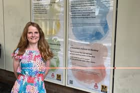 Gosforth poet Anna Woodford with the latest poetry displays at Longbenton Metro station.