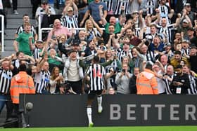 Alexander Isak of Newcastle United celebrates after scoring the team’s second goal with the fans during the Premier League match between Newcastle United and Aston Villa at St. James Park on August 12, 2023 in Newcastle upon Tyne, England. 