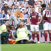 Tyrone Mings of Aston Villa looks dejected after sustaining an injury during the Premier League match between Newcastle United and Aston Villa at St. James Park on August 12, 2023 in Newcastle upon Tyne, England. (Photo by George Wood/Getty Images)
