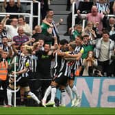Sandro Tonali of Newcastle United celebrates with team mates and fans after scoring the opening goal (Photo by Stu Forster/Getty Images)