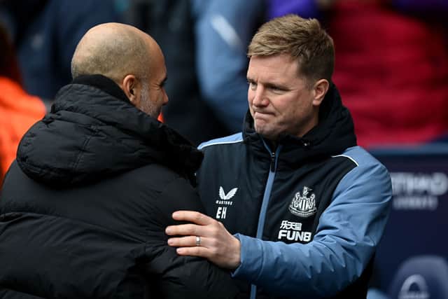 Pep Guardiola, Manager of Manchester City, and Eddie Howe, Manager of Newcastle United, interact prior to the Premier League match between Manchester City and Newcastle United at Etihad Stadium on March 04, 2023 in Manchester, England. (Photo by Michael Regan/Getty Images)