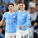 Manchester City duo Julian Alvarez (left) and Phil Foden (right). (Photo by Michael Regan/Getty Images)