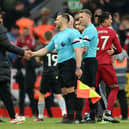 Jurgen Klopp, Manager of Liverpool, shakes hands with Assistant Referee Constantine Hatzidakis after the Premier League match between Liverpool FC and Arsenal FC at Anfield on April 09, 2023 in Liverpool, England. (Photo by Shaun Botterill/Getty Images)