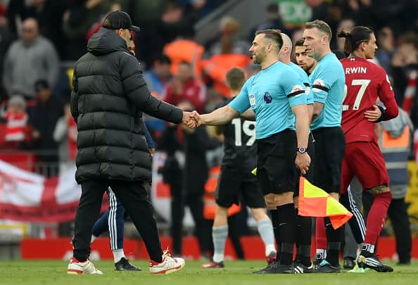 Jurgen Klopp, Manager of Liverpool, shakes hands with Assistant Referee Constantine Hatzidakis after the Premier League match between Liverpool FC and Arsenal FC at Anfield on April 09, 2023 in Liverpool, England. (Photo by Shaun Botterill/Getty Images)