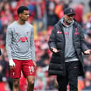 Jurgen Klopp, Manager of Liverpool, interacts with Cody Gakpo and Mohamed Salah of Liverpool prior the Premier League match between Liverpool FC and Brentford FC at Anfield on May 06, 2023 in Liverpool, England. (Photo by Alex Livesey/Getty Images)