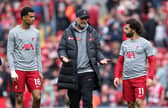 Jurgen Klopp, Manager of Liverpool, interacts with Cody Gakpo and Mohamed Salah of Liverpool prior the Premier League match between Liverpool FC and Brentford FC at Anfield on May 06, 2023 in Liverpool, England. (Photo by Alex Livesey/Getty Images)