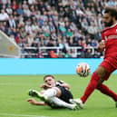 Sven Botman of Newcastle United blocks the shot of Mohamed Salah of Liverpool during the Premier League match between Newcastle United and Liverpool FC at St. James Park on August 27, 2023 in Newcastle upon Tyne, England.