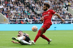 Sven Botman of Newcastle United blocks the shot of Mohamed Salah of Liverpool during the Premier League match between Newcastle United and Liverpool FC at St. James Park on August 27, 2023 in Newcastle upon Tyne, England.