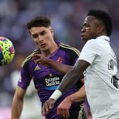 Real Valladolid's Spanish defender Ivan Fresneda (L) vies with Real Madrid's Brazilian forward Vinicius Junior during the Spanish league football match between Real Madrid CF and Real Valladolid FC at the Santiago Bernabeu stadium in Madrid on April 2, 2023. (Photo by Thomas COEX / AFP) (Photo by THOMAS COEX/AFP via Getty Images)