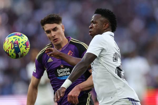 Real Valladolid's Spanish defender Ivan Fresneda (L) vies with Real Madrid's Brazilian forward Vinicius Junior during the Spanish league football match between Real Madrid CF and Real Valladolid FC at the Santiago Bernabeu stadium in Madrid on April 2, 2023. (Photo by Thomas COEX / AFP) (Photo by THOMAS COEX/AFP via Getty Images)