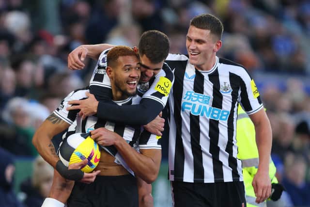 Joelinton of Newcastle United celebrates scoring the 3rd goal with Bruno Guimaraes and Sven Botman during the Premier League match between Leicester City and Newcastle United at The King Power Stadium on December 26, 2022 in Leicester, United Kingdom. (Photo by Marc Atkins/Getty Images)