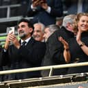 Newcastle United's Saudi Arabian chairman Yasir Al-Rumayyan (L) and Newcastle United's English minority owner Amanda Staveley (C) applaud the players ahead of the English League Cup final football match between Manchester United and Newcastle United at Wembley Stadium, north-west London on February 26, 2023. (Photo by Glyn KIRK / AFP) 
