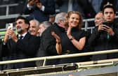 Newcastle United's Saudi Arabian chairman Yasir Al-Rumayyan (L) and Newcastle United's English minority owner Amanda Staveley (C) applaud the players ahead of the English League Cup final football match between Manchester United and Newcastle United at Wembley Stadium, north-west London on February 26, 2023. (Photo by Glyn KIRK / AFP) 