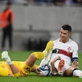 Newcastle United goalkeeper Martin Dubravka is caught by Cristiano Ronaldo (Photo by VLADIMIR SIMICEK/AFP via Getty Images)