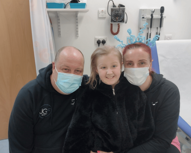 Grace Frazer with her parents.