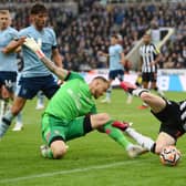 Anthony Gordon of Newcastle United is fouled by Mark Flekken of Brentford leading to a penalty decision during the Premier League match between Newcastle United and Brentford FC at St. James Park on September 16, 2023 in Newcastle upon Tyne, England. (Photo by Stu Forster/Getty Images)