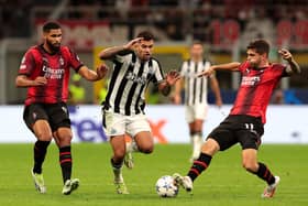  Bruno Guimaraes of Newcastle United challenges for the ball with Olivier Giroud and Christian Pulisic of AC Milan during the UEFA Champions League Group F match between AC Milan and Newcastle United FC at Stadio Giuseppe Meazza on September 19, 2023 in Milan, Italy. (Photo by Emilio Andreoli/Getty Images)