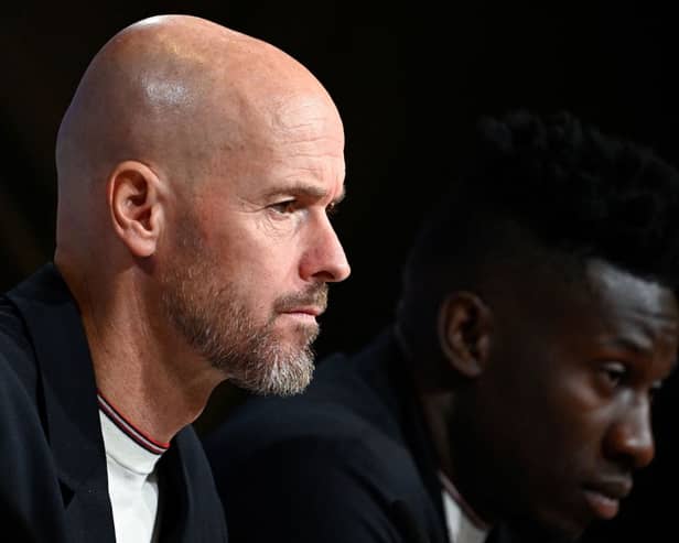Manchester United manager Erik ten Hag and goalkeeper Andre Onana.  (Photo by TOBIAS SCHWARZ/AFP via Getty Images)