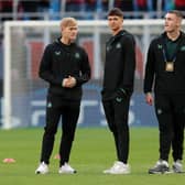  Lewis Hall (L), Lewis Miley (C) and Aidan Harris (R) of Newcastle United inspect the pitch prior to the UEFA Champions League Group F match between AC Milan and Newcastle United FC at Stadio Giuseppe Meazza on September 19, 2023 in Milan, Italy. (Photo by Emilio Andreoli/Getty Images)