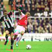 Gilberto of Arsenal is challenged by Jermaine Jenas of Newcastle during the Premier League match between Newcastle United and Arsenal on February 9, 2003  (Arsenal FC via Getty Images)