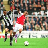 Gilberto of Arsenal is challenged by Jermaine Jenas of Newcastle during the Premier League match between Newcastle United and Arsenal on February 9, 2003  (Arsenal FC via Getty Images)