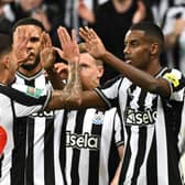 Newcastle United’s Swedish striker #14 Alexander Isak (R) celebrates scoring the opening goal during the English League Cup third round football match between Newcastle United and Manchester City at St James' Park in Newcastle-upon-Tyne, north east England on September 27, 2023. (Photo by Oli SCARFF / AFP) 