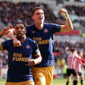 Callum Wilson of Newcastle United celebrates with teammate Sven Botman after scoring the team's third goal which is later disallowed during the Premier League match between Brentford FC and Newcastle United at Brentford Community Stadium on April 08, 2023 in Brentford, England. (Photo by Alex Pantling/Getty Images)