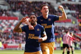 Callum Wilson of Newcastle United celebrates with teammate Sven Botman after scoring the team's third goal which is later disallowed during the Premier League match between Brentford FC and Newcastle United at Brentford Community Stadium on April 08, 2023 in Brentford, England. (Photo by Alex Pantling/Getty Images)