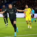 Kylian Mbappe of Paris Saint-Germain celebrates after scoring the team’s first goal from the penalty spot during the UEFA Champions League Group F match between Paris Saint-Germain and Borussia Dortmund (Johannes Simon/Getty Images)