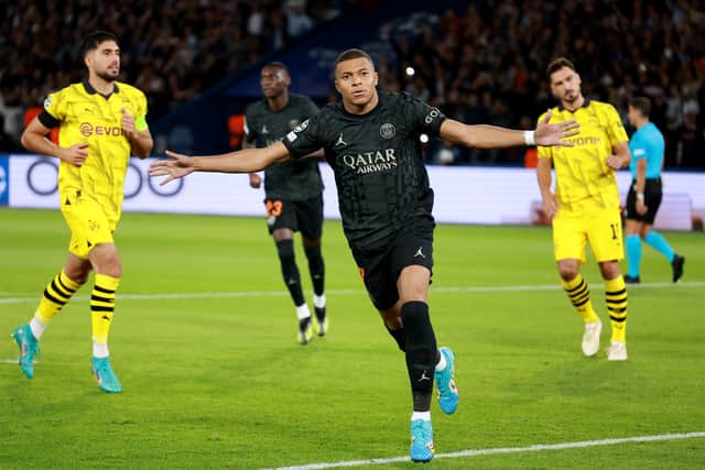 Kylian Mbappe of Paris Saint-Germain celebrates after scoring the team’s first goal from the penalty spot during the UEFA Champions League Group F match between Paris Saint-Germain and Borussia Dortmund (Johannes Simon/Getty Images)