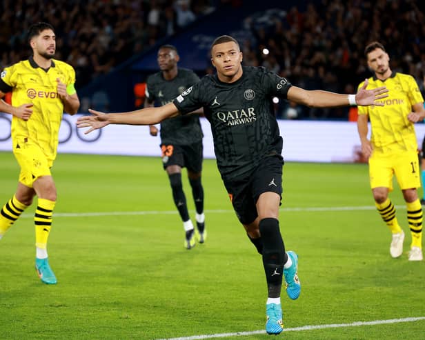 Kylian Mbappe of Paris Saint-Germain celebrates after scoring the team’s first goal from the penalty spot during the UEFA Champions League Group F match between Paris Saint-Germain and Borussia Dortmund (Johannes Simon/Getty Images)